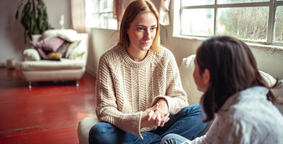 Mother talking to her daughter about COVID-19