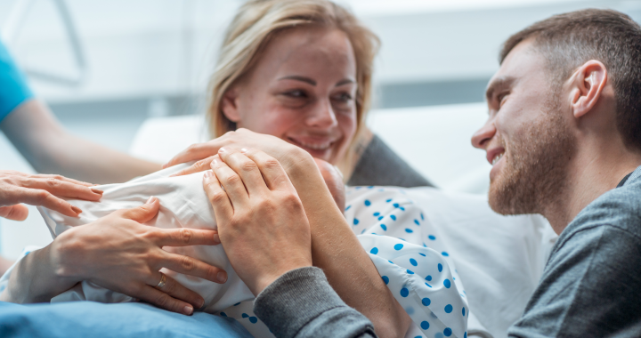 Baby with parents after being born in a hospital