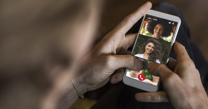 A person communicating with family members over video chat during COVID-19