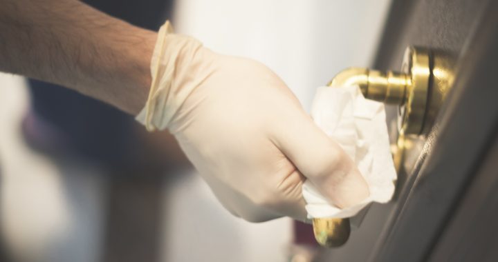 Individual cleaning and disinfecting a door handle at home