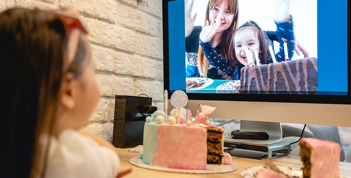 Family hosting a virtual birthday party for their child during COVID-19.