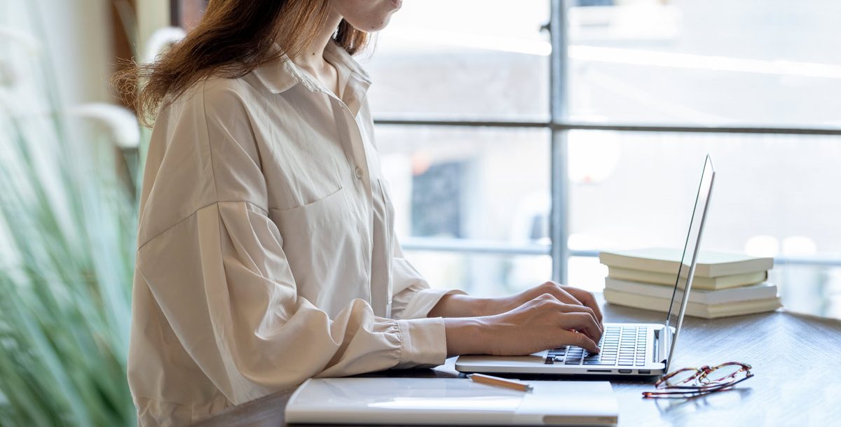 Woman working in her in home work space during COVID-19.