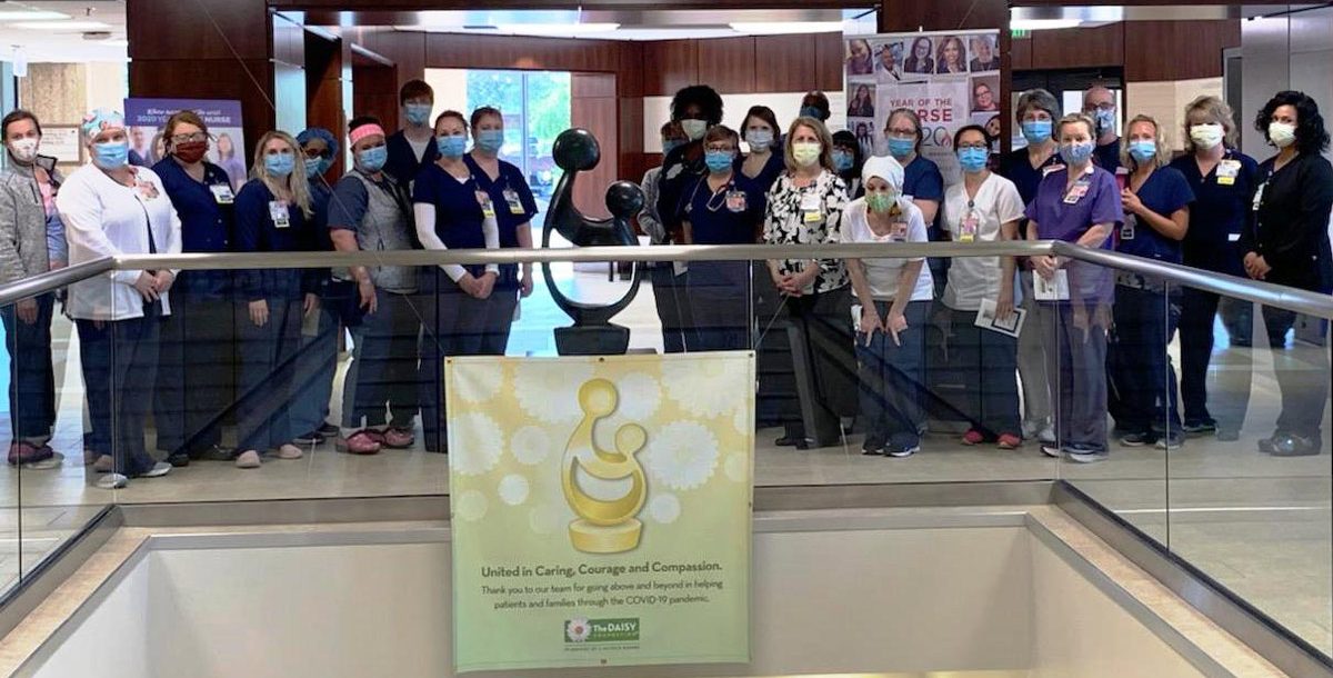 The St. Mary's Hospital Nurses check out their new DAISY Sculpture