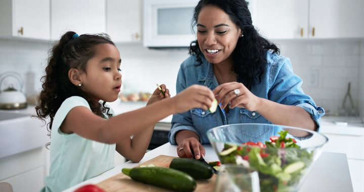 Mother cooking pantry recipes with daughter during COVID-19.