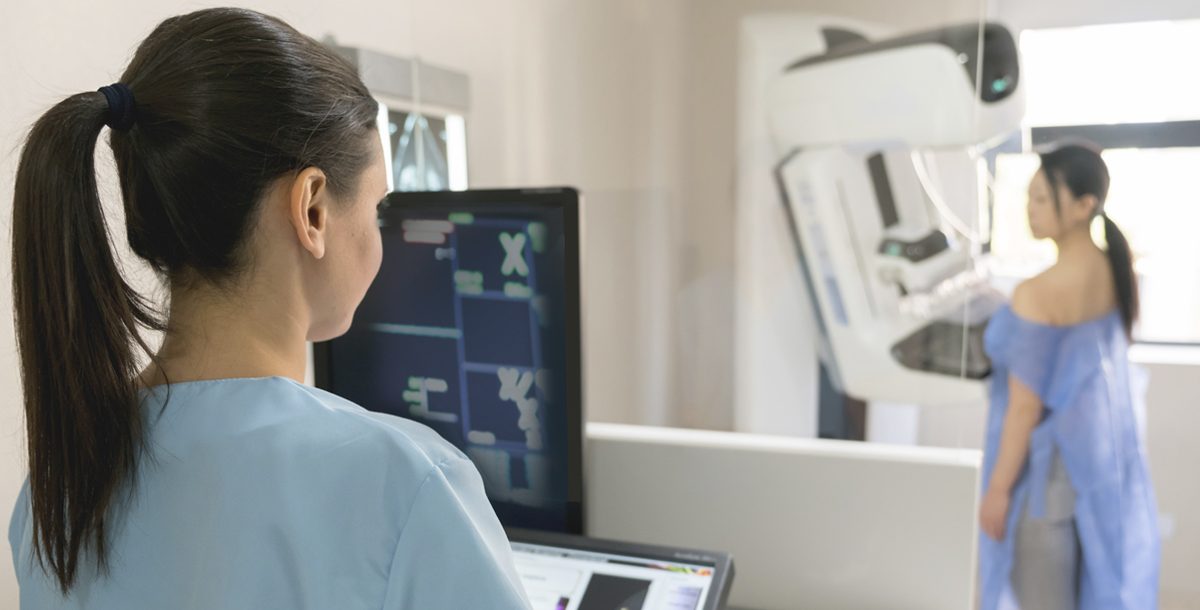 A woman receiving her annual mammogram screening.