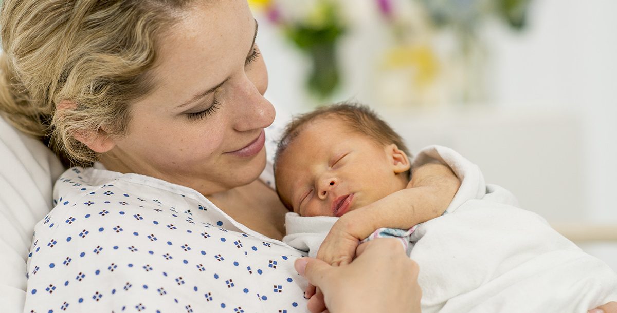 A mother giving birth safely at the hospital during COVID-19.