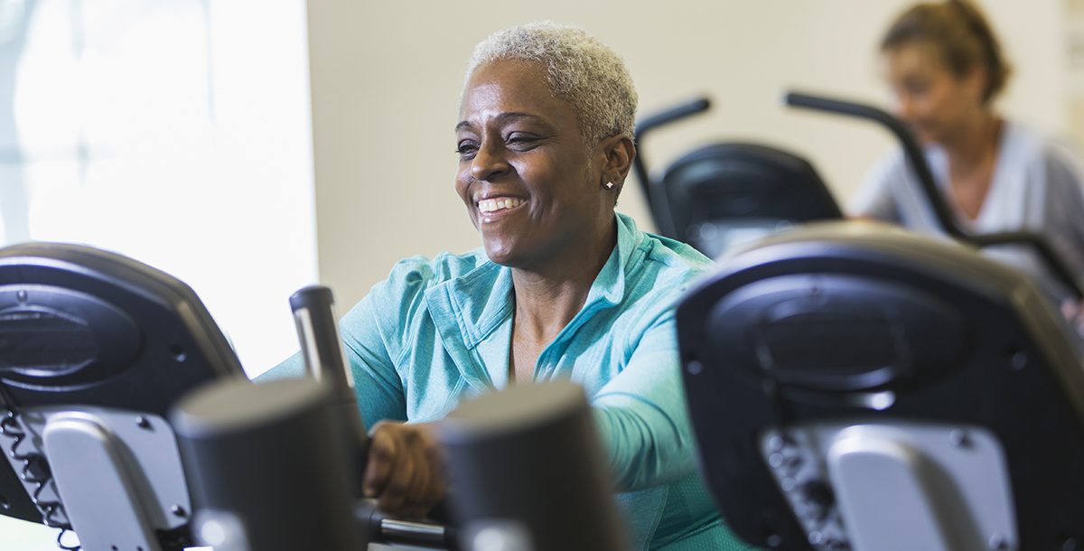 A woman doing cardio at the gym during COVID-19