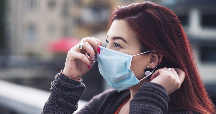 A woman wearing her face mask correctly during COVID-19.