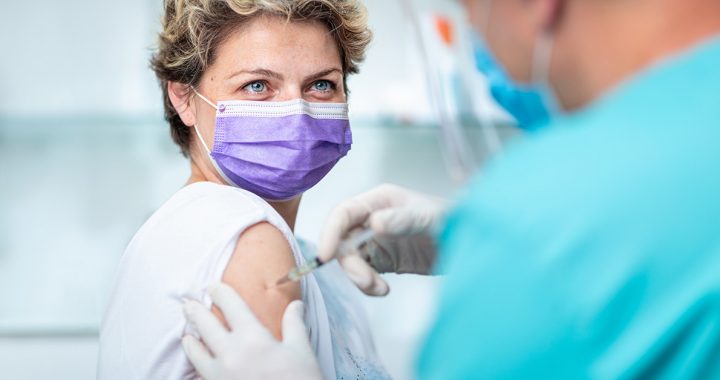 A woman getting her flu shot during COVID-19.