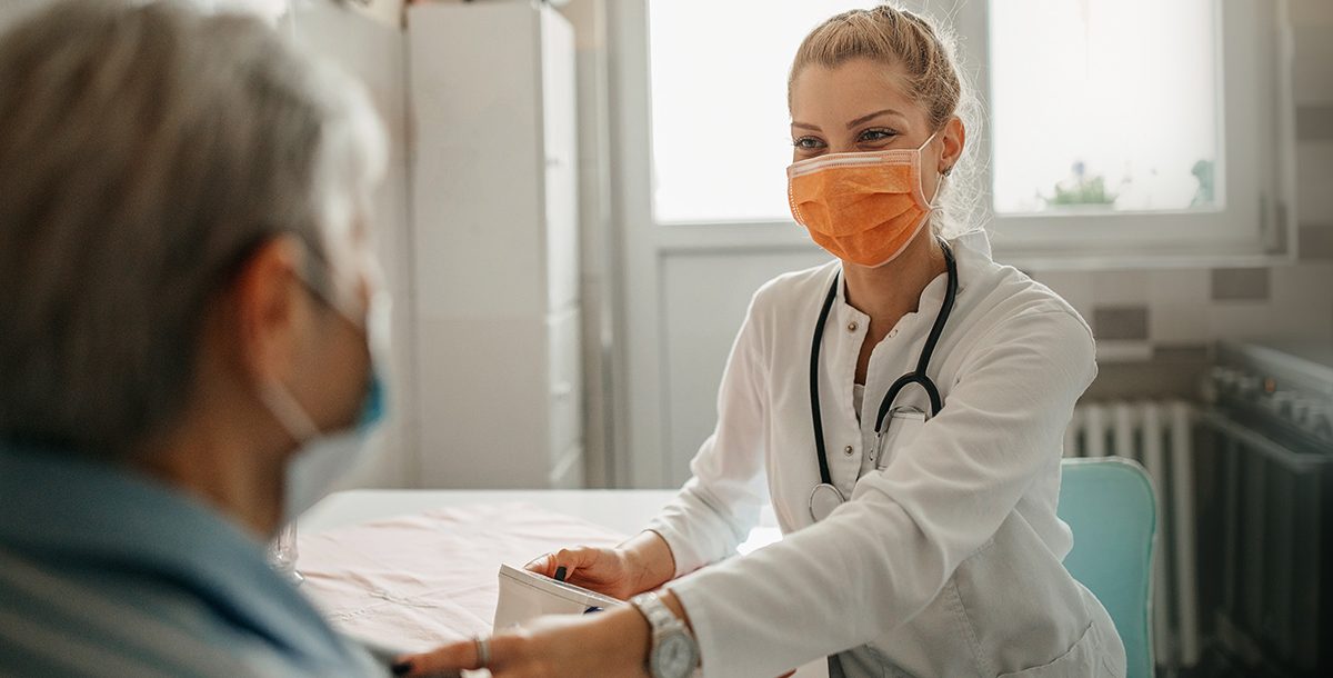 A patient going over their health screening results with their primary care provider.