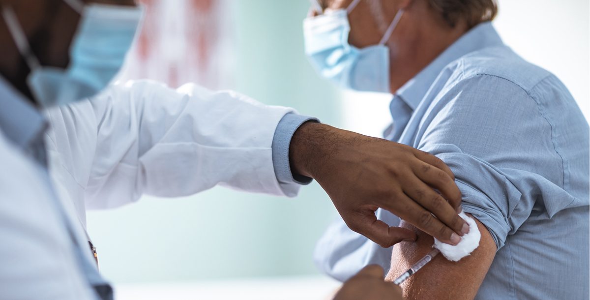 A patient getting a flu vaccine from their provider.