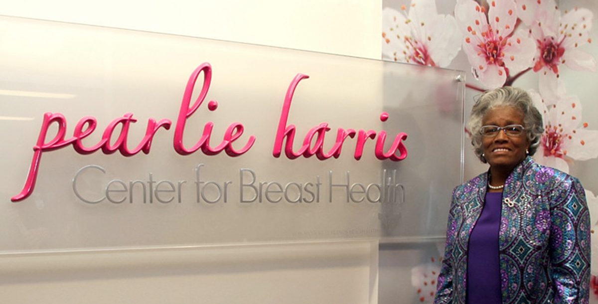 Pearlie Harris next to her sign at the Bon Secours breast cancer center in Greenville, SC