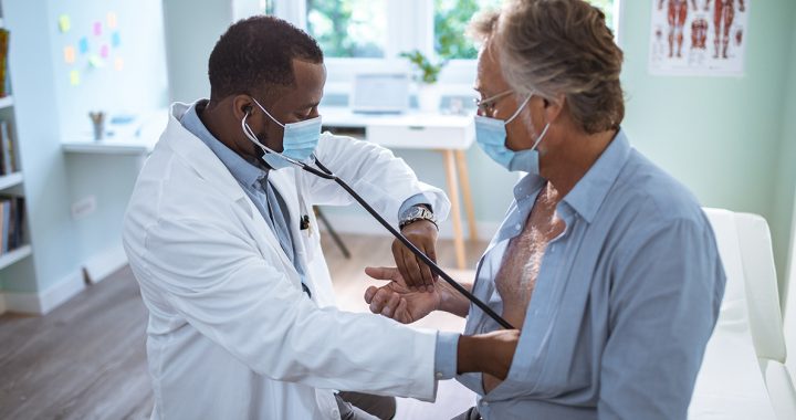 A man at a checkup appointment with his primary care provider.