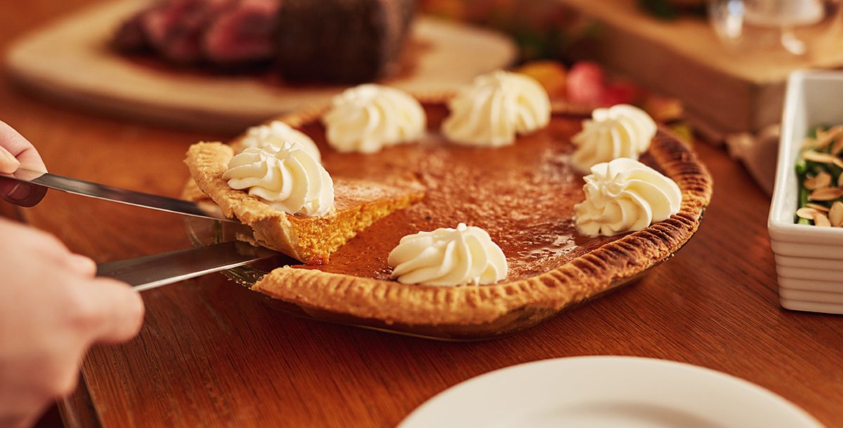 A pumpkin pie on a table