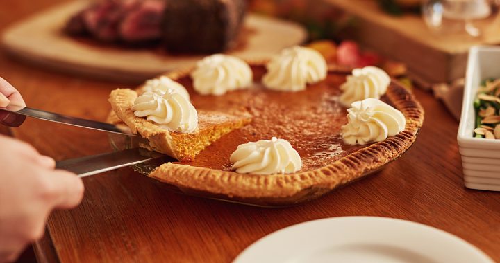 A pumpkin pie on a table