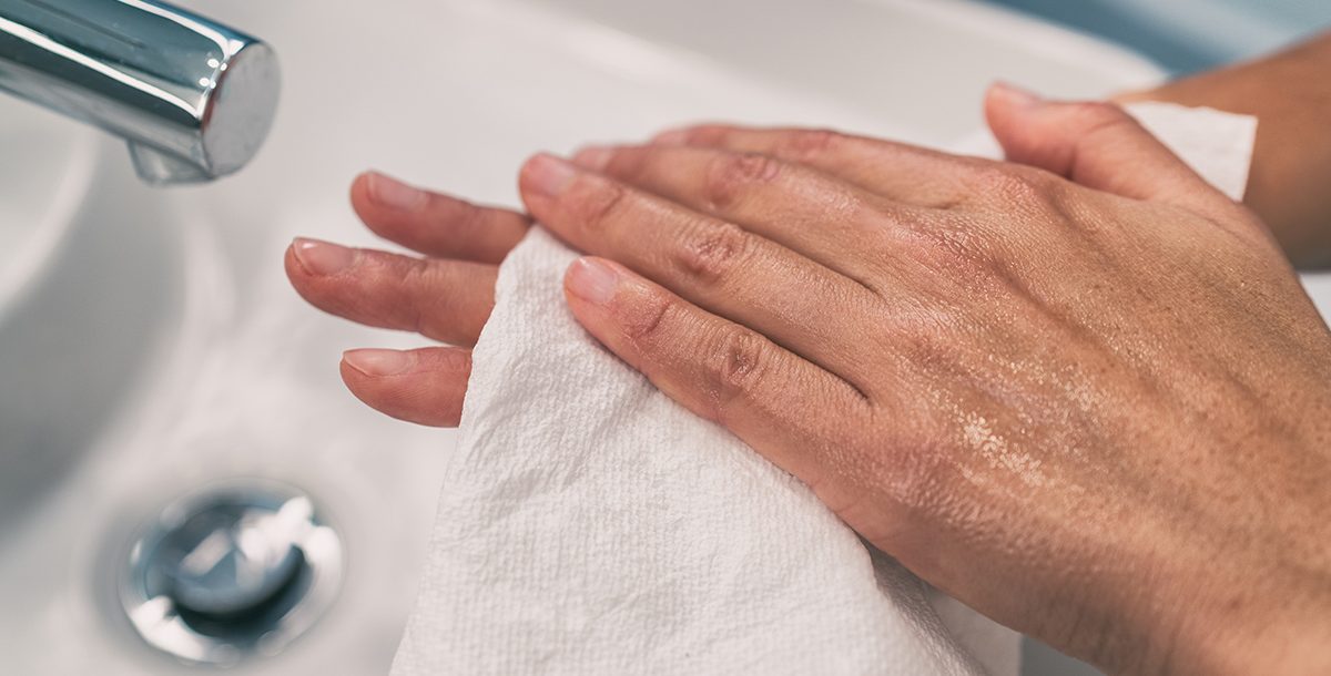 A person with dry hands from lots of handwashing.