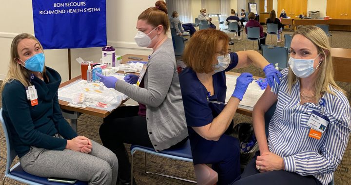 Cassie Lewis receiving her first and second COVID-19 vaccines.