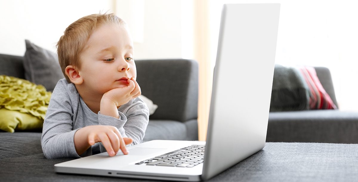 A child looking at a computer screen.