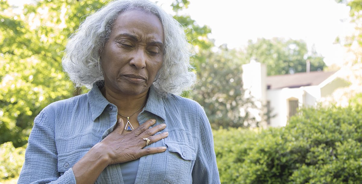 A woman experiencing heart pain