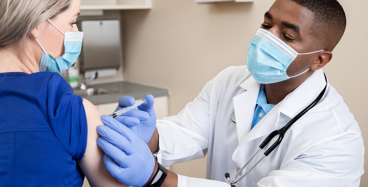 A woman receiving her COVID-19 vaccine.