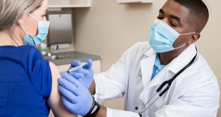 A woman receiving her COVID-19 vaccine.