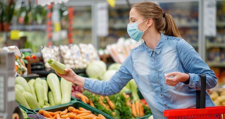 A woman enjoying a farmers market.