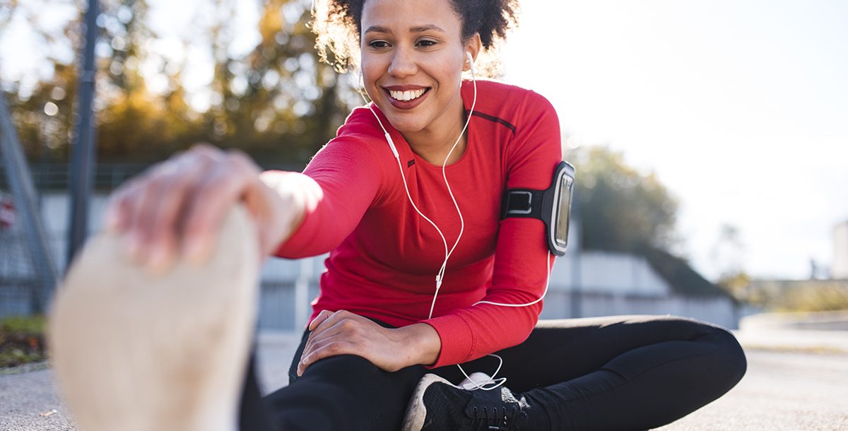 A woman stretching before her run.