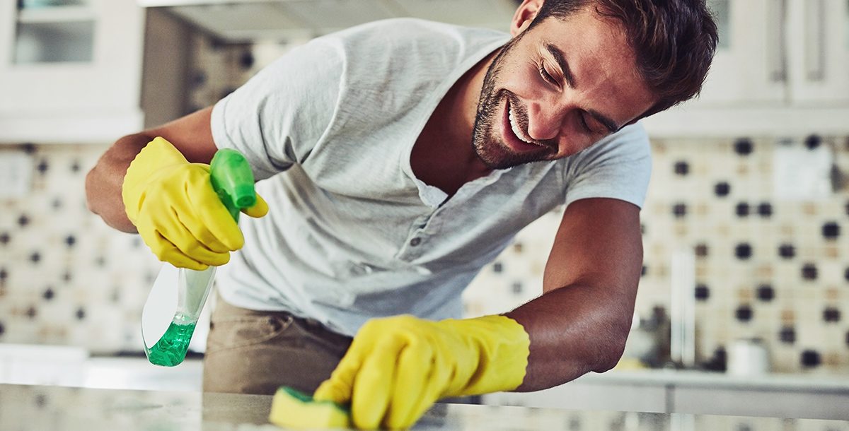 A man spring cleaning his house.