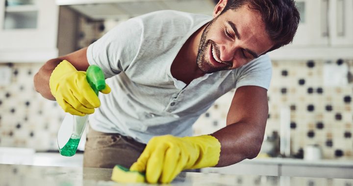 A man spring cleaning his house.