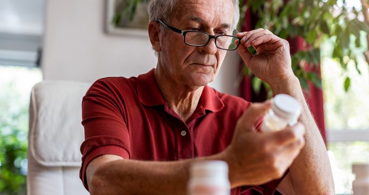 A man comparing medications.