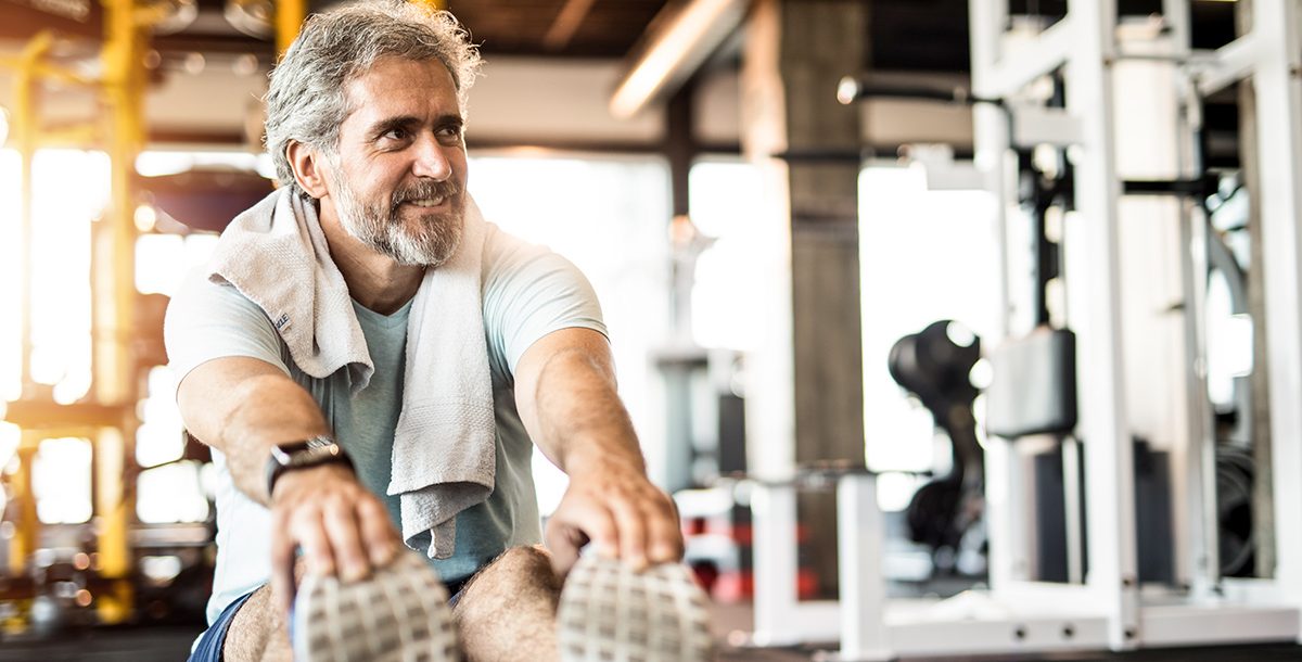 A man exercising after finishing cancer treatment.