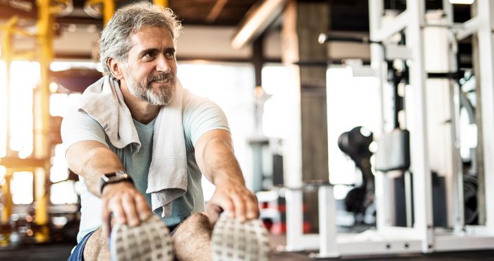 A man exercising after finishing cancer treatment.