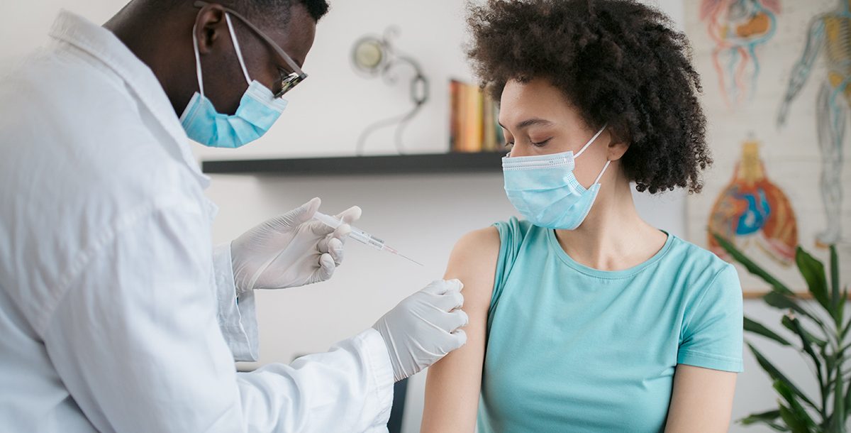 A woman getting her COVID-19 vaccine.