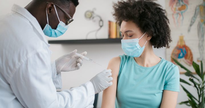 A woman getting her COVID-19 vaccine.