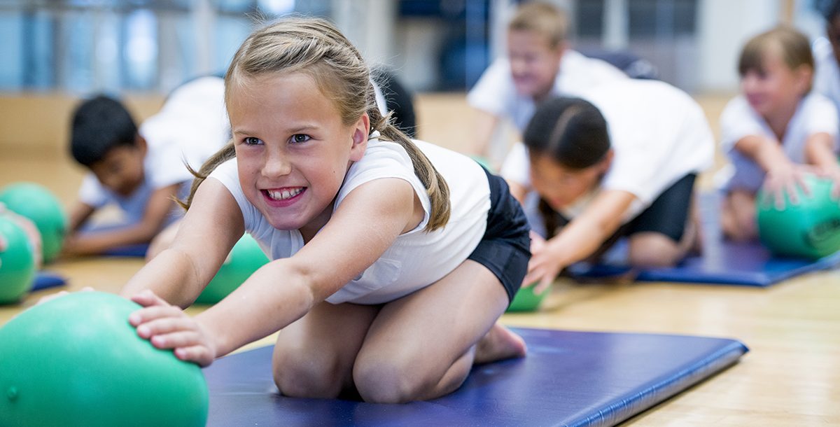 A child participating in PE class at school.