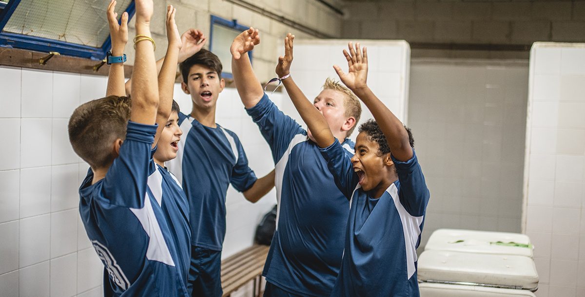 Student athletes in a locker room together.