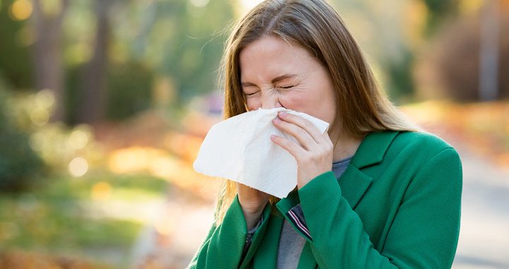 A woman suffering from fall allergies.