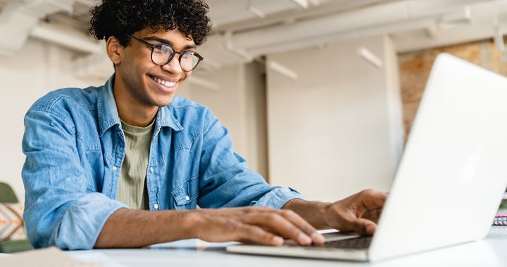 A person filling out a survey on a computer.