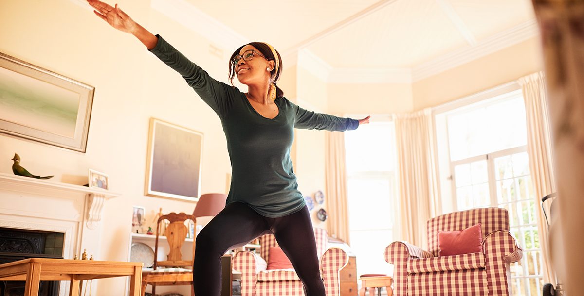 A woman practicing yoga in the morning