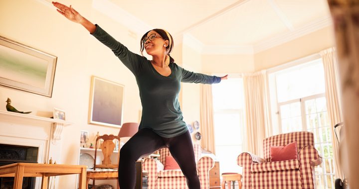 A woman practicing yoga in the morning