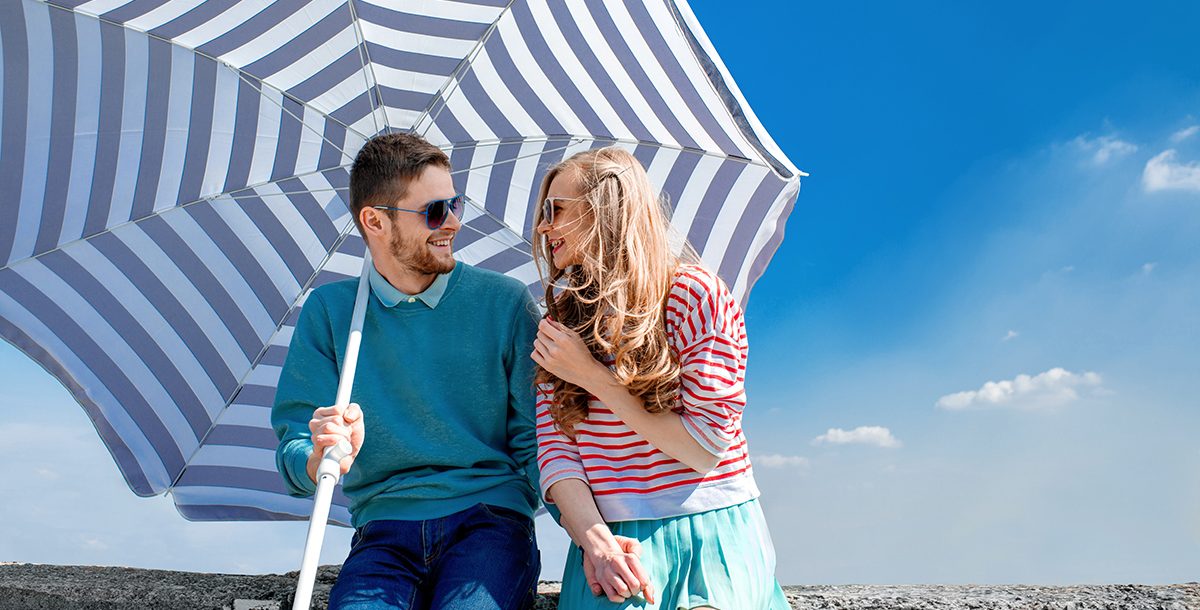 a couple using an umbrella