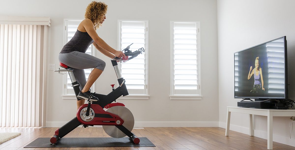 a woman cycling indoors